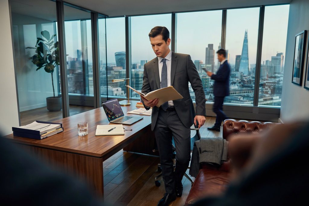 Alex Cowper-Smith inspired corporate leader in a luxury office environment.